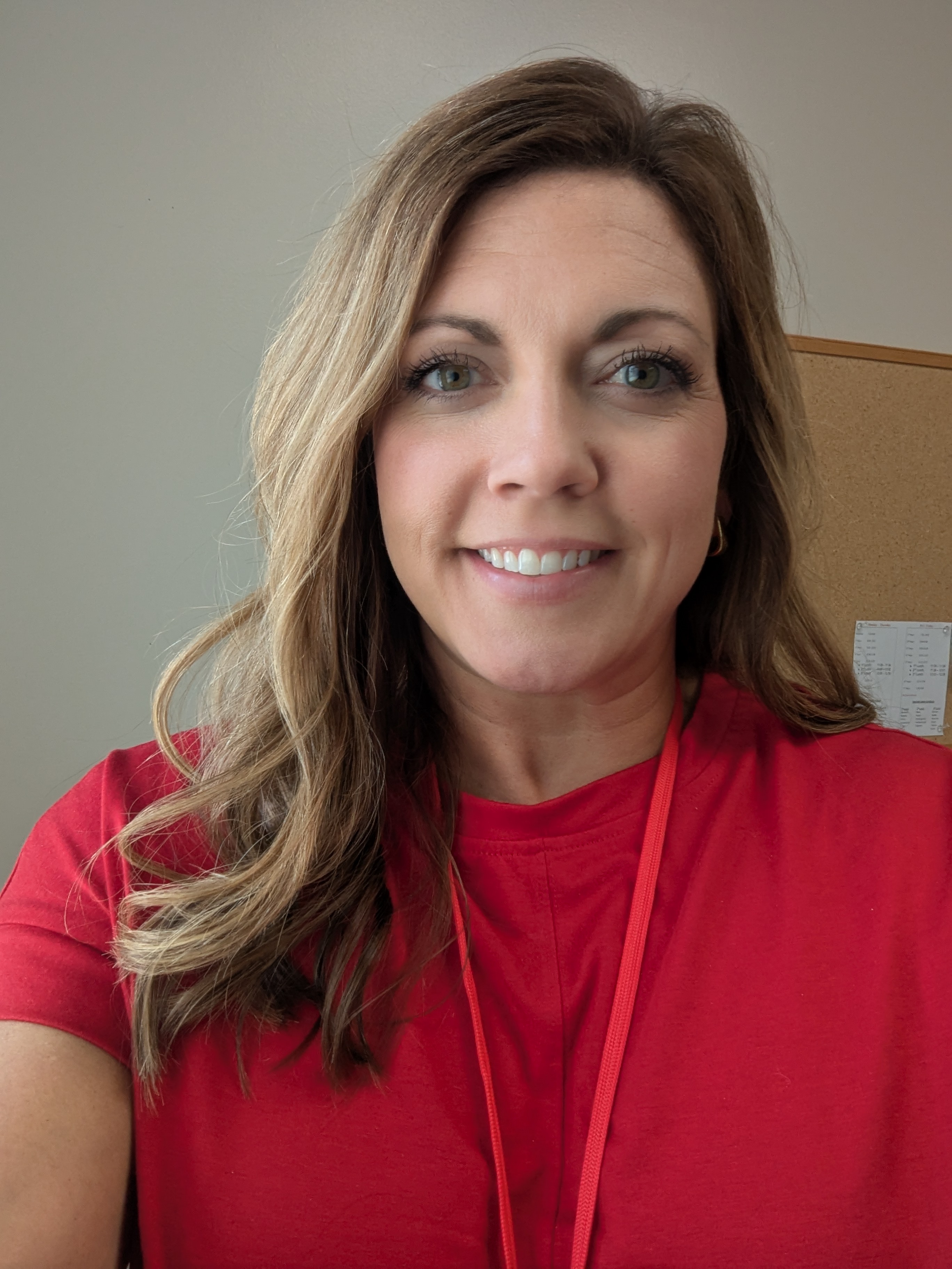 Photo of Amanda Eilders wearing a red blouse.